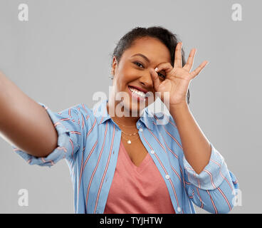 happy african american woman taking selfie Stock Photo