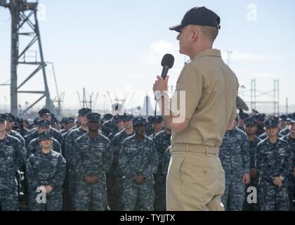 SAN DIEGO (Nov. 10, 2016) Master Chief Petty Officer of the Navy (MCPON) Steven Giordano discusses the Navy's rating modernization efforts during an all hands call aboard amphibious assault ship USS Boxer (LHD 4). The rating modernization plan builds on the Sailor 2025 roadmap to better grow and utilize fleet talent. It will allow Sailors to experience a broader range of professional experiences and opportunities. Boxer is currently pier side preparing for a planned maintenance availability. Stock Photo