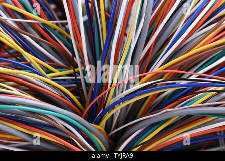 Bundle of colorful wires and cables closeup, used in telecommunication network and electrical systems Stock Photo