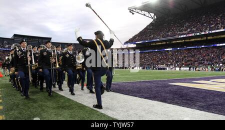 JOINT BASE LEWIS-MCCHOROD, Wash. – Soldiers from the I Corps Band march off the field after performing alongside the University of Washington Marching Band prior to the Washington Huskies and USC Trojans football game in Seattle Nov. 12. The I Corps Band performed both America the Beautiful and the Star Spangled Banner as part of UW’s Salute to Service. Stock Photo