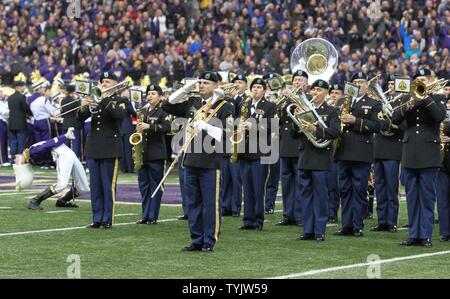 JOINT BASE LEWIS-MCCHOROD, Wash. – Soldiers from the I Corps Band perform the Star Spangled Banner alongside the University of Washington Marching Band prior to the Washington Huskies and USC Trojans football game in Seattle Nov. 12. The I Corps Band performed both America the Beautiful and the Star Spangled Banner as part of UW’s Salute to Service. Stock Photo