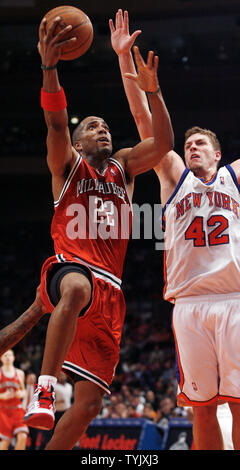 Milwaukee Bucks Michael Redd (22) shoots a lay up while New York Knicks David Lee plays defense at Madison Square Garden in New York City on December 19, 2008.     (UPI Photo/John Angelillo) Stock Photo