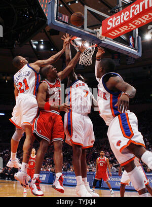 Milwaukee Bucks Michael Redd (22) New York Knicks Wilson Chandler (21) and Al Harrington (7) fight for a lose ball under the basket in the second quarter at Madison Square Garden in New York City on December 19, 2008.     (UPI Photo/John Angelillo) Stock Photo