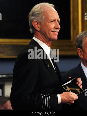 Mayor Michael Bloomberg  presents Captain Chesley Sullenberger (shown) and the flight crew of US Airways Flight 1549 with keys to the city during City Hall ceremonies in New York on February 9, 2009.   (UPI Photo/Ezio Petersen) Stock Photo