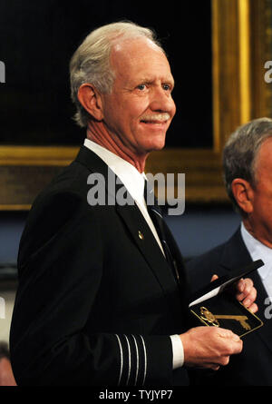 Mayor Michael Bloomberg  presents Captain Chesley 'Sully' Sullenberger (shown) and the flight crew of US Airways Flight 1549 with keys to the city during City Hall ceremonies in New York on February 9, 2009.   (UPI Photo/Ezio Petersen) Stock Photo