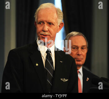 Mayor Michael Bloomberg (r) presents Captain Chesley Sullenberger and the flight crew of US Airways Flight 1549 with keys to the city during City Hall ceremonies in New York on February 9, 2009.   (UPI Photo/Ezio Petersen) Stock Photo