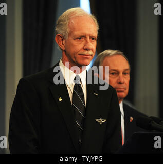 Mayor Michael Bloomberg (r) presents Captain Chesley Sullenberger and the flight crew of US Airways Flight 1549 with keys to the city during City Hall ceremonies in New York on February 9, 2009.   (UPI Photo/Ezio Petersen) Stock Photo