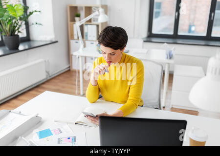 ui designer using smartphoneat office Stock Photo