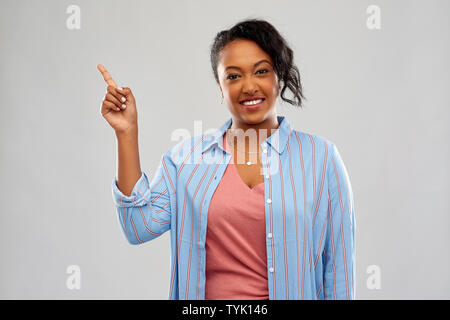 happy african american woman pointing finger up Stock Photo