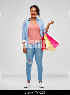 happy african american woman with shopping bags Stock Photo