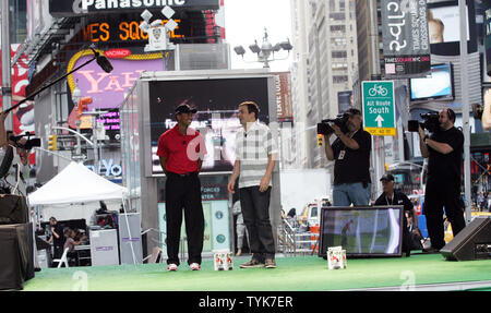 Tiger Woods challenges Jimmy Fallon to Tiger Woods PGA TOUR 10 Wii Golf showdown in Times Square in New York on June 25, 2009.  Jimmy Fallon won the challenge.   (UPI Photo/Laura Cavanaugh) Stock Photo