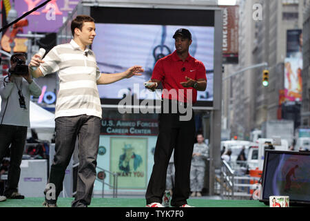 Tiger Woods challenges Jimmy Fallon to Tiger Woods PGA TOUR 10 Wii Golf showdown in Times Square in New York on June 25, 2009.  Jimmy Fallon won the challenge.   (UPI Photo/Laura Cavanaugh) Stock Photo