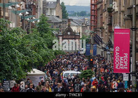 Glasgow, Scotland - June 8, 2019: The famous shopping district in the city, Buchanan Street, is shown filled with people during an afternoon day. Stock Photo