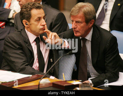 French Prime Minister Nicolas Sarcozy  (L) and French Foreign Minister Bernard Kouchner listen to speakers at the Security Council meeting at the United Nations on  September 24, 2009 in New York City.     UPI /Monika Graff Stock Photo