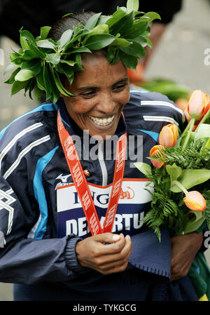 Derartu Tulu of Ethiopia celebrates after winning the women's' division of the New York City Marathon on November 1, 2009 in New York City. Approximately 40,000 runners from all over the world run the course which winds through all five boroughs of the city.      UPI/Monika Graff Stock Photo