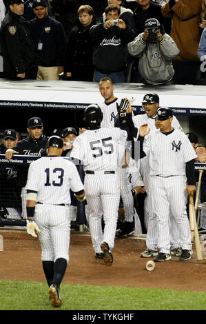 New York Yankees' Hideki Matsui, #55, is congratulated by team