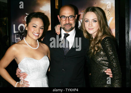 Nikki SooHoo, Stanley Tucci and Saoirse Ronan arrive for the New York special screening of 'The Lovely Bones' at the Paris Theatre in New York on December 2, 2009.       UPI /Laura Cavanaugh Stock Photo