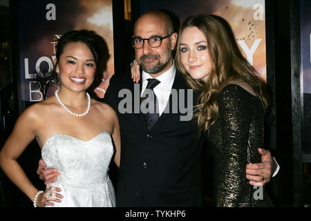 Nikki SooHoo, Stanley Tucci and Saoirse Ronan arrive for the New York special screening of 'The Lovely Bones' at the Paris Theatre in New York on December 2, 2009.       UPI /Laura Cavanaugh Stock Photo