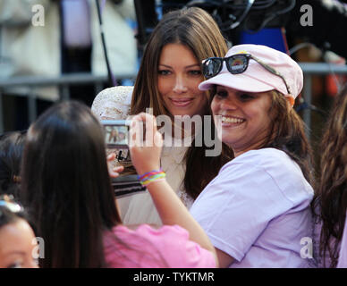 Actress Jessica Biel takes pictures with fans before Christina Aguilera performs on the NBC Today Show at Rockefeller Center in New York City on June 8, 2010.       UPI/John Angelillo Stock Photo