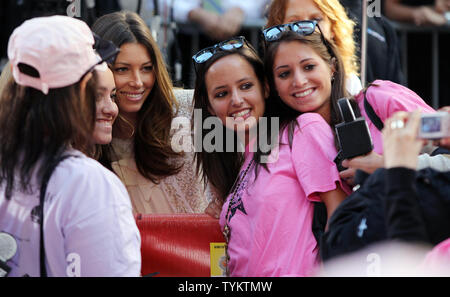 Actress Jessica Biel takes pictures with fans before Christina Aguilera performs on the NBC Today Show at Rockefeller Center in New York City on June 8, 2010.       UPI/John Angelillo Stock Photo