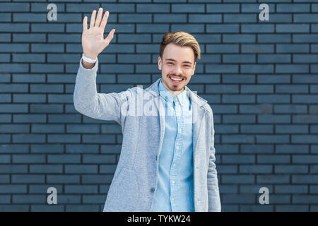 Hi, nice to see you. Portrait of happy handsome young blonde man