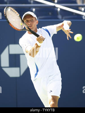 Nikolay Davydenko of Russia returns the ball to Michael Russell of the USA during first-round action at the U.S. Open held at the National Tennis Center on August 30, 2010 in New York.     UPI Photo/Monika Graff... Stock Photo