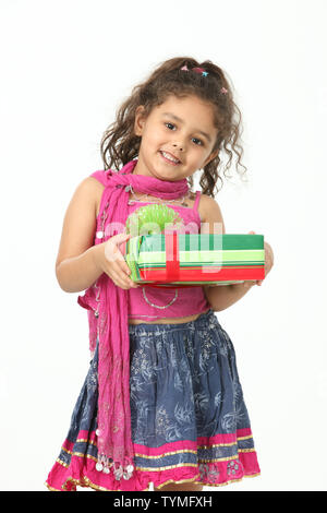 Portrait of a girl holding a gift box Stock Photo