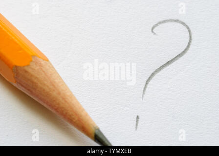 Pencil and written question mark on white paper and copy space. Stock Photo