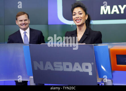 Nicole Scherzinger and NASDAQ Executive Vice President Bruce Aust   react before ringing the opening bell while promoting the movie Men In Black III at the NASDAQ in Times Square in New York City on May 23, 2012.    UPI/John Angelillo Stock Photo