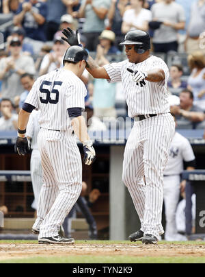 New York Yankees Russell Martin celebrates with Andruw Jones after he hits a 2-run home run in the seventh inning against the New York Mets at Yankee Stadium in New York City on June 10, 2012.     UPI/John Angelillo Stock Photo