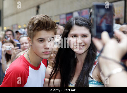 Justin Bieber meets fans outside of the Ed Sullivan Theater before appearing on the Late Show with David Letterman in New York City on June 20, 2012.       UPI/John Angelillo Stock Photo