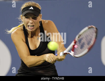 Caroline Wozniacki of Denmark hits a backhand in the second set of her first round match against Irina-Camelia Begu of Romania at the 2012 U.S. Open Tennis Championships in Arthur Ashe Stadium at the Billie Jean King National Tennis Center in New York City on August 28, 2012. Camelia Begu defeated Wozniacki  6-3, 6-2.      UPI/John Angelillo Stock Photo