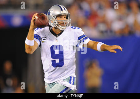 Dallas Cowboys quarterback Tony Romo (9) runs out of the pocket looking to  pass against the New York Giants in the fourth quarter in week 1 of the NFL  season at MetLife Stadium in East Rutherford, New Jersey on September 5,  2012. UPI/Rich Kane Stock