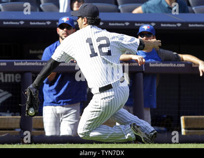 New York Yankees Eric Chavez throws to first base in the first inning  against the Boston