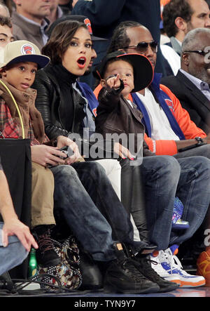 Alicia Keys and Baby Egypt watch the New York Knicks play the Miami Heat in the first quarter in the Knicks Home opener at Madison Square Garden in New York City on November 2, 2012.     UPI/John Angelillo Stock Photo