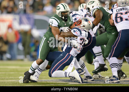 New York Jets inside linebacker Bart Scott (57) tackles New England Patriots running back Stevan Ridley (22) in the second quarter in week 12 of the NFL season at MetLife Stadium in East Rutherford, New Jersey on November 22,  2012.     UPI/Rich Kane Stock Photo