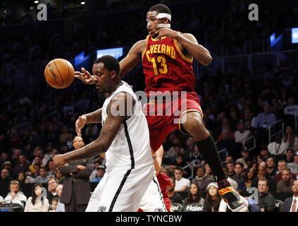 Cleveland Cavaliers Tristan Thompson passes the ball around Brooklyn Nets Andray Blatche in the first half at the Barclays Center in New York City on December 29, 2012.        UPI/John Angelillo Stock Photo