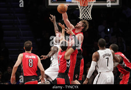 Toronto Raptors Aaron Gray blocks a shot from Brooklyn Nets Andray Blatche in the fourth quarter at the Barclays Center in New York City on January 15, 2013. The Nets defeated the Raptors 113-106.      UPI/John Angelillo Stock Photo