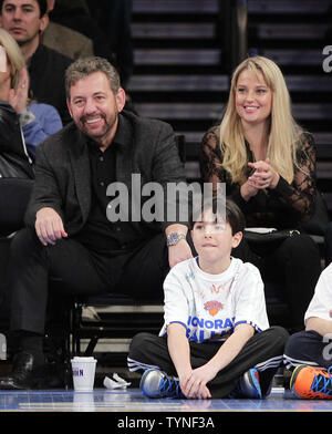 President and CEO of Cablevision Systems James L. Dolan and Sports Illustrated model Genevieve Morton watch the Utah Jazz play the New York Knicks at Madison Square Garden in New York City on March 9, 2013.    UPI/John Angelillo Stock Photo