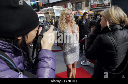 Photographers gather around a new wax figure of Britney Spears when it is placed on a red carpet outside at Madame Tussauds in New York City on March 26, 2013.       UPI/John Angelillo Stock Photo