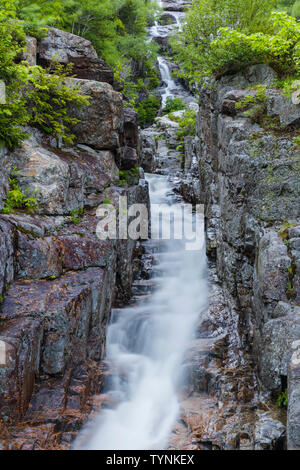 Silver Cascade in Crawford Notch State Park in the New Hampshire White Mountains during the spring months. Stock Photo