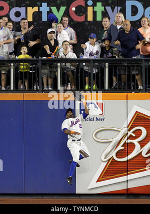 New York Mets' Eric Young Jr. waits to bat in the first inning of their ...