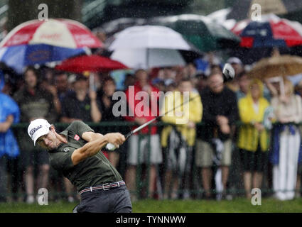 Adam Scott hits his tee shot on the 12th hole during the first round of ...