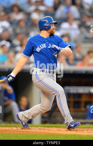 Toronto Blue Jays first baseman Adam Lind (26) singles to left against the New York Yankees at Yankee Stadium in New York City on August 21, 2013.  UPI/Rich Kane Stock Photo