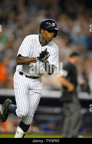 New York Yankees left fielder Alfonso Soriano (12) reacts after hitting his two run homerun in the eighth inning against the Toronto Blue Jays at Yankee Stadium in New York City on August 21, 2013.  UPI/Rich Kane Stock Photo