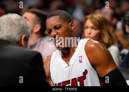 Miami Heat point guard Mario Chalmers (15) reacts after Heat trainer checks his wrist during the first quarter against the Brooklyn Nets at Barclays Center in New York City on November 1, 2013.   UPI/Rich Kane Stock Photo