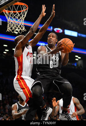 Brooklyn Nets center Andray Blatche (0) drives the basket against Miami Heat center Joel Anthony (50) in the fourth quarter at Barclays Center in New York City on November 1, 2013.   UPI/Rich Kane Stock Photo