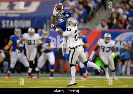 Wide receiver Victor Cruz (80) of the New York Giants kissed the  championship trophy at the conclusion of Superbowl XLVI on Sunday, February  5, 2012, at Lucas Oil Stadium in Indianapolis, Indiana.