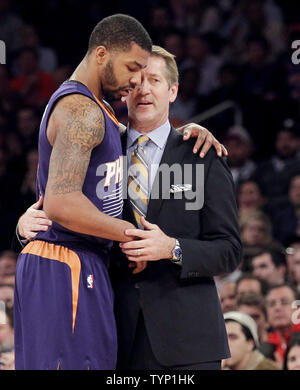 Phoenix Suns head coach Jeff Hornacek holds Markieff Morris after he is ejected from the game after his 2nd technical foul in the first half against the New York Knicks at Madison Square Garden in New York City on January 13, 2014. The Knicks defeated the Suns 98-96 in overtime.   UPI/John Angelillo Stock Photo