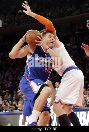 Los Angeles Clippers Blake Griffin dunks the ball by Boston Celtics Jordan  Crawford during first half action in Los Angeles on January 8, 2014. The  Clippers lead the Celtics at halftime 59-55.